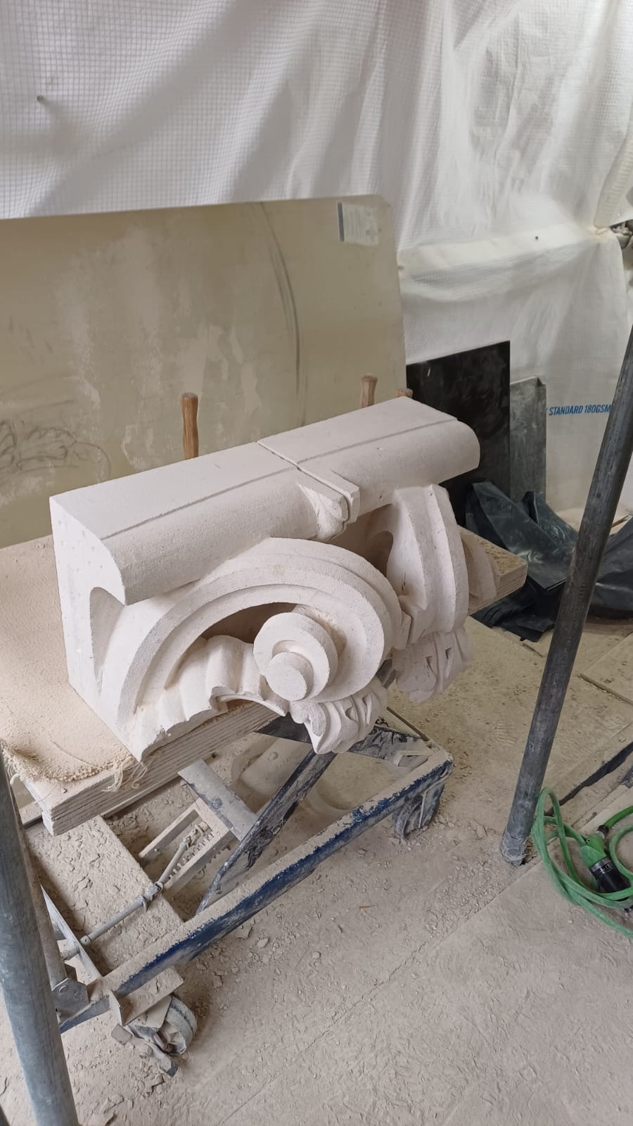 Traditional stone repair — new stone embedded in masonry in compression